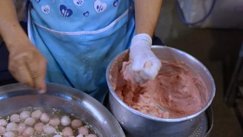 Making fresh meatballs with hands and a spoon Stock Footage 260360013