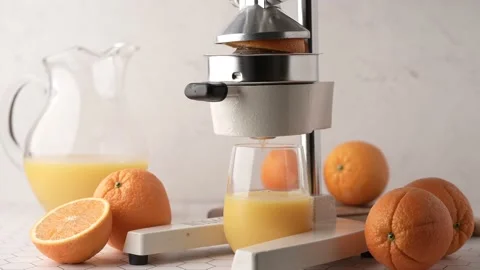 Making fresh orange juice with squeezer Stock Footage 158332824