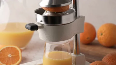 Making fresh orange juice with squeezer Stock Footage 158333185