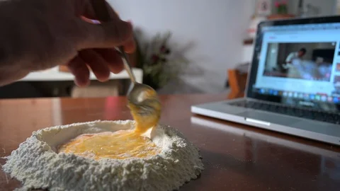 Making fresh pasta by watching a tutorial on the Internet 스톡 동영상 128312281