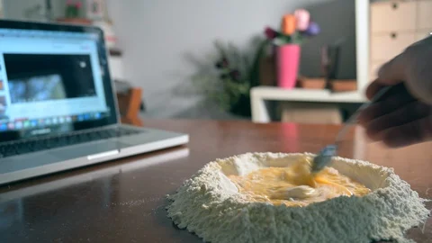 Making fresh pasta by watching a tutorial on the Internet Stock Footage 128312810