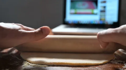 Making fresh pasta by watching a tutorial on the Internet Stock Footage 128319815