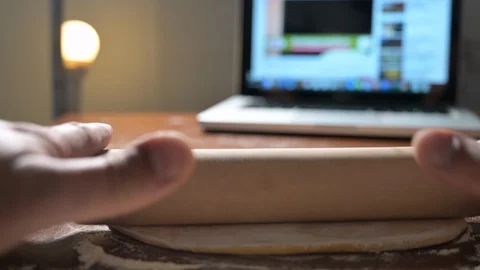 Making fresh pasta by watching a tutorial on the Internet Stock Footage 128398090
