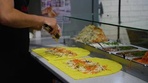 Making Fresh Shawarma Wraps with Vegetables Stock Footage 311483695