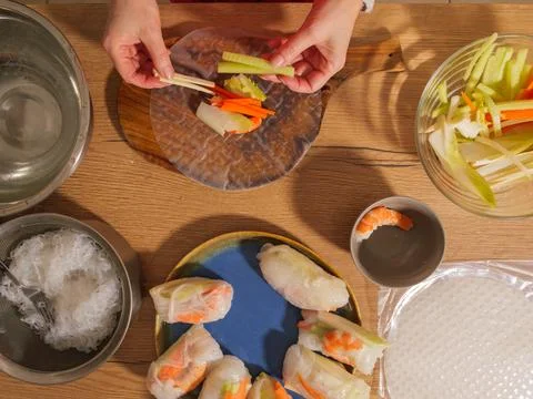 Making fresh spring rolls with vegetables and shrimp top view Stock Photos