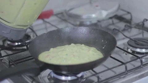 Making fried chickpeas omelet in a hot fridge with oil Stock Footage 79539457