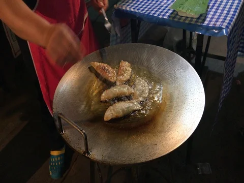 Making fried dumplings at open air market Stock Footage 79191372