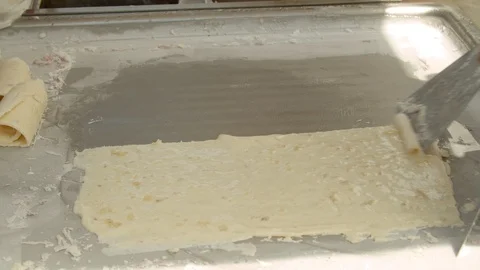 Making fried ice cream with spatulas on a frozen surface Video stock 109601915
