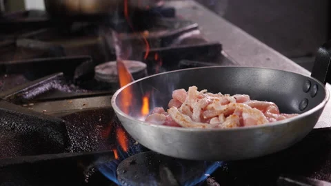 Making fried pork strips, tossing the pan Stock Footage 152776255