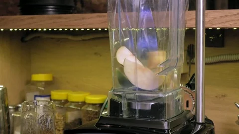Making a fruit cocktail in a blender Stock Footage 105986845