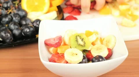 Making a fruit salad Stock Footage 11072983