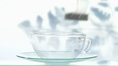 Making fruit tea: pouring hot water onto tea bag Stock Footage 8570498