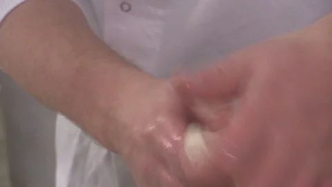 Making genuine italian mozzarella cheese Stock Footage 95651069