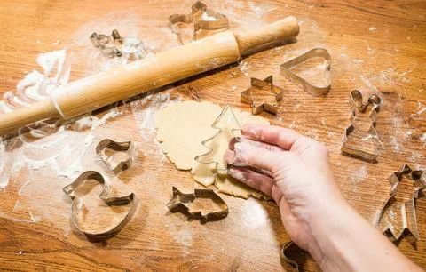 Making ginger pastry, cookie cutters on wooden background Stock Photos