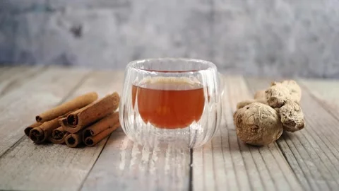 Making ginger tea with cinnamon and fresh ginger root Stock Footage 340122652