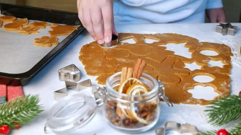 Making gingerbread cookies. Child cuts circle and put it on baking sheet Stock Footage 164256470