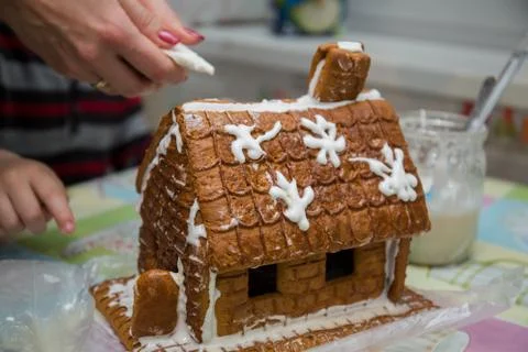 Making a gingerbread house on the kitchen table Stock Photos