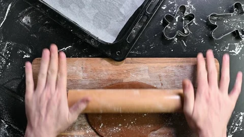 Making gingerbread man cookies with cookie cutters Stock Footage 145229990