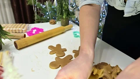 Making gingerbread people with hands while preparing for Christmas Stock Footage 344820869