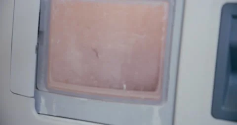 Making glasses, Close up of Machine for grinding and trimming lenses for glasses Stock Footage 131345524