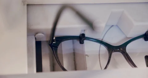Making glasses, glasses empte frame in optician measuring machine, close up Video stock 130105510