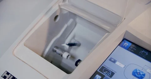 Making glasses, installs the lens in the devicer grinding and trimming lenses Stock Footage 130104935