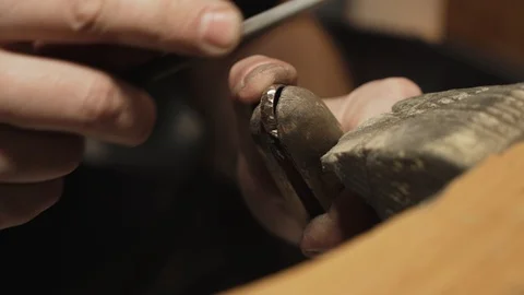 Making a gold ring. 4K footage. Create faces on the ring. Stock Footage 105259449