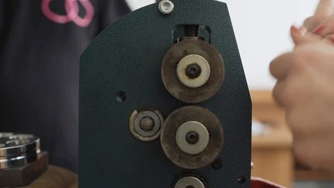 Making a gold ring. Broaching the blank for the ring. 4K footage Stock Footage 105259333