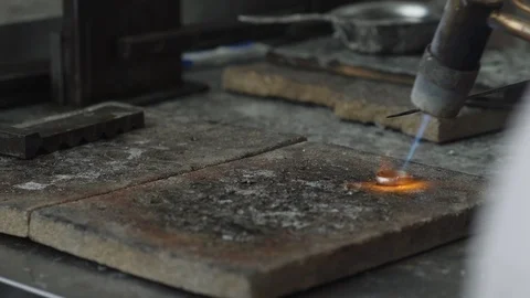 Making a gold ring. Tempering the jewelry. Stock Footage 105259359
