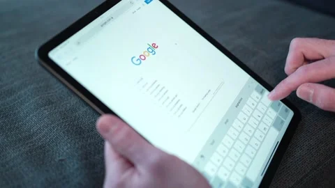 Making a Google Search Online on a Tablet Touch Screen Closeup Stock-Footage 180055087