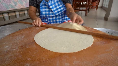 Making gozleme, organic spinach bread with a mother in kitchen. Stock Footage 122438601