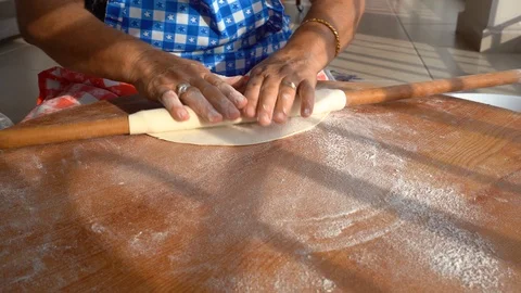 Making gozleme, organic spinach bread with a mother in kitchen. Stock Footage 122438665