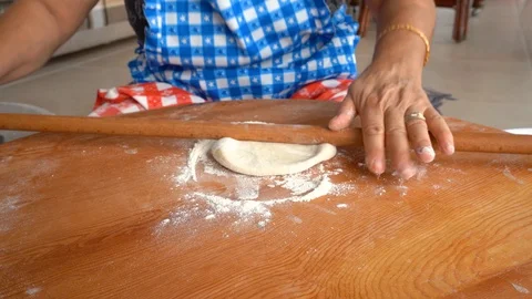 Making gozleme, organic spinach bread with a mother in kitchen. Stock Footage 122438672