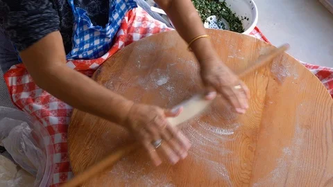 Making gozleme, organic spinach bread with a mother in kitchen. Stock Footage 122438739