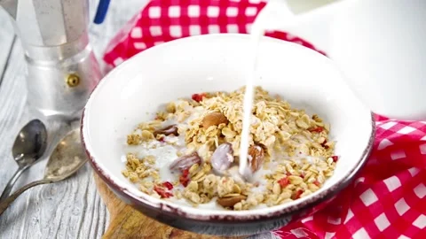Making granola flakes breakfast Stock Footage 169587358