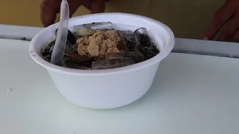 Making grass jelly in white foam cup with sugar, ice and milk Stock Footage 141306042