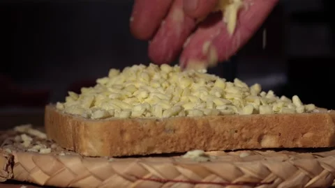 Making a grated cheese sandwich Stock Footage 270773280