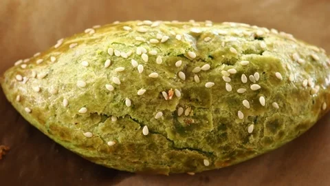 Making a green sesame bread in a local bakery kitchen Видео 338041920