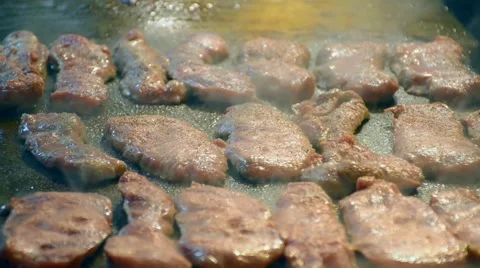 Making of grilled beef  steak on hot plate with smoke Stock Footage 61554462