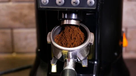 Making ground coffee with coffee grinder. Close-Up. Stock Footage 106463725
