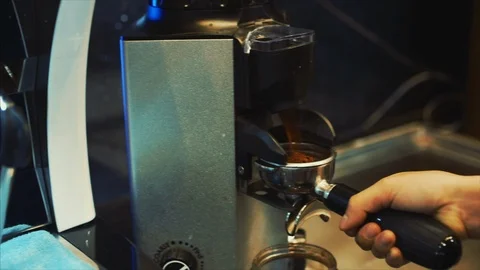 Making Ground Coffee with Coffee Grinder. Close-Up. Coffee machine. Stock Footage 118236142