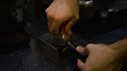 Making Ground Coffee with Tamping fresh coffee. Close-Up. Stock Footage 106468512