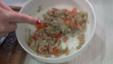 Making guacamole in the kitchen Stock Footage 232131641
