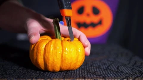 Making a Halloween lantern from a pumpkin Stock Footage 164324150