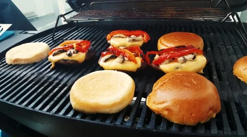 Making Hamburger on grill Stock Footage 53088972