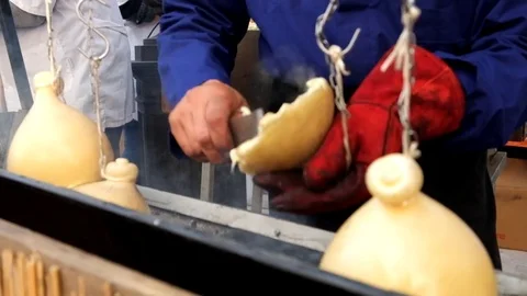Making hanged melted cheese on barbeque Stock Footage 81597262