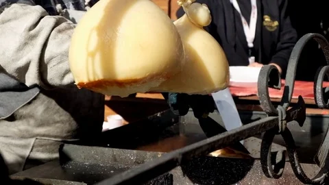 Making hanged melted cheese on barbeque and serve on crepes Stock Footage 81597550