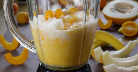 Making a Healthy Raw Vegan Melon banana Smoothie Stock Footage 158828872
