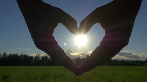 Making heart with hands over the sun Stock Footage 40463504