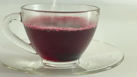 Making hibiscus tea with hibiscus syrup and hot water Stock Footage 189181018